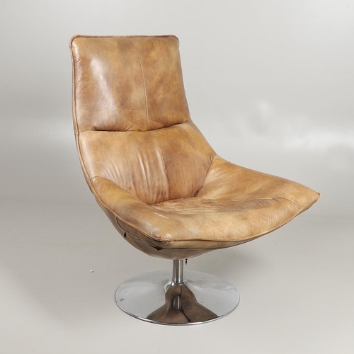 671 - ANDREW MARTIN - DESIGNER LEATHER SWIVEL CHAIR 'CARLOTTA'. A leather swivel chair of large proportion... 