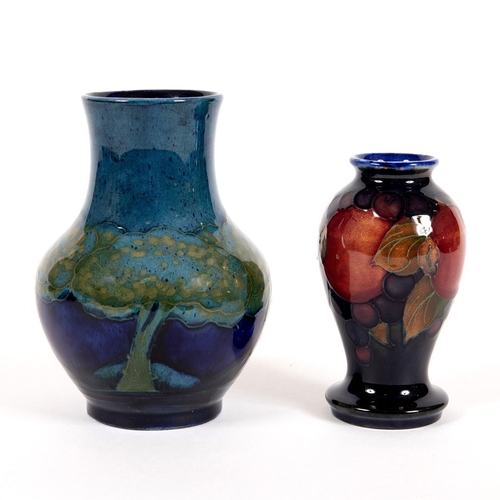 733 - MOORCROFT MOONLIT BLUE VASE & MINIATURE POMEGRANATE VASE. A Moorcroft vase of squat form in the Moon... 