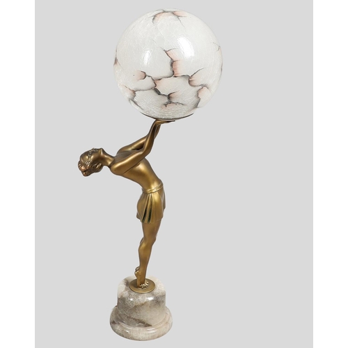 737 - ART DECO FIGURAL LAMP & SHADE. A spelter table lamp in the form of lady balanced on tip toes, the fi... 