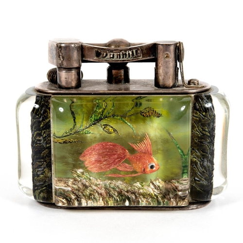 740 - DUNHILL AQUARIUM TABLE LIGHTER. A table lighter with lucite panels and silver plated mounts, carved ... 