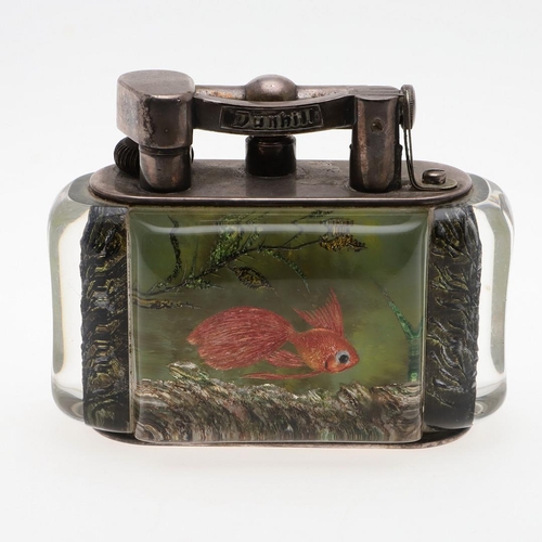 740 - DUNHILL AQUARIUM TABLE LIGHTER. A table lighter with lucite panels and silver plated mounts, carved ... 