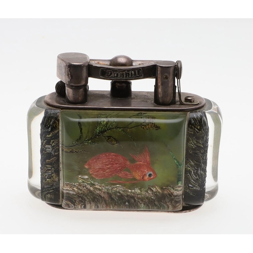 740 - DUNHILL AQUARIUM TABLE LIGHTER. A table lighter with lucite panels and silver plated mounts, carved ... 