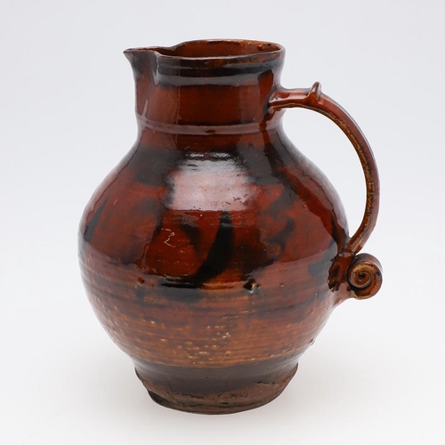 743 - EARLY ST IVES STUDIO POTTERY JUG - SLIPWARE. Possibly by Michael Cardew and circa 1920's/30's, the s... 