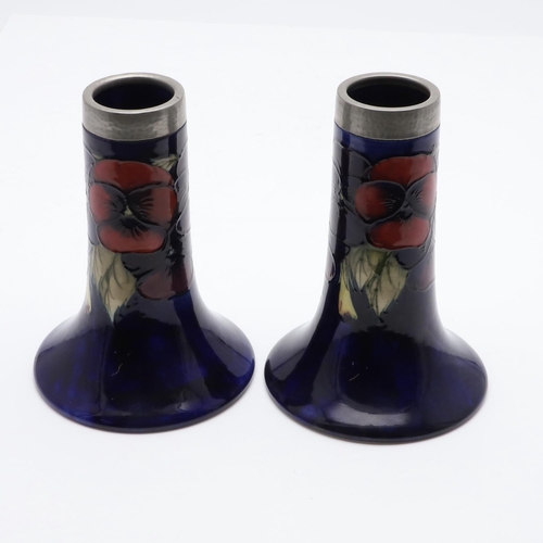 745 - PAIR OF ANTIQUE MOORCROFT VASES & PEWTER MOUNTS. A pair of bell shaped vases, painted in the Pansy d... 