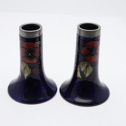 745 - PAIR OF ANTIQUE MOORCROFT VASES & PEWTER MOUNTS. A pair of bell shaped vases, painted in the Pansy d... 