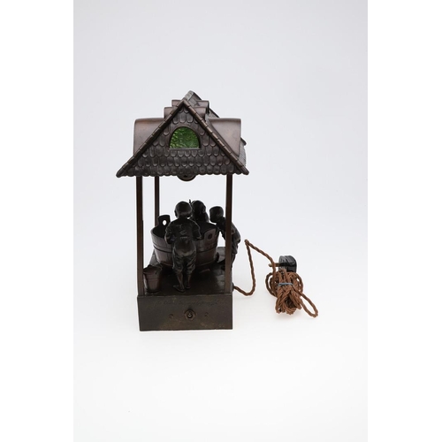 746 - OSWALD SCHIMMELPFENNIG - GERMAN BRONZE FIGURAL TABLE LAMP. In the form of three children fishing fro... 