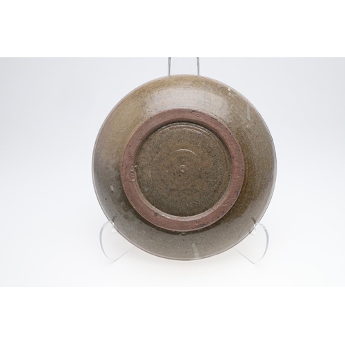 748 - TREVOR CORSER (1938-2015) - ST IVES STUDIO POTTERY BOWL. A stoneware bowl with a green ash glaze, de... 