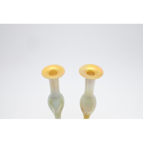 753 - LOUIS COMFORT TIFFANY - PAIR OF FAVRILE IRIDESCENT GLASS VASES. A pair of slender iridescent glass v... 