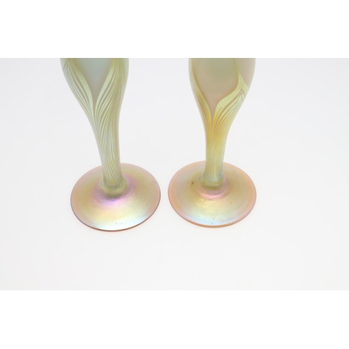 753 - LOUIS COMFORT TIFFANY - PAIR OF FAVRILE IRIDESCENT GLASS VASES. A pair of slender iridescent glass v... 