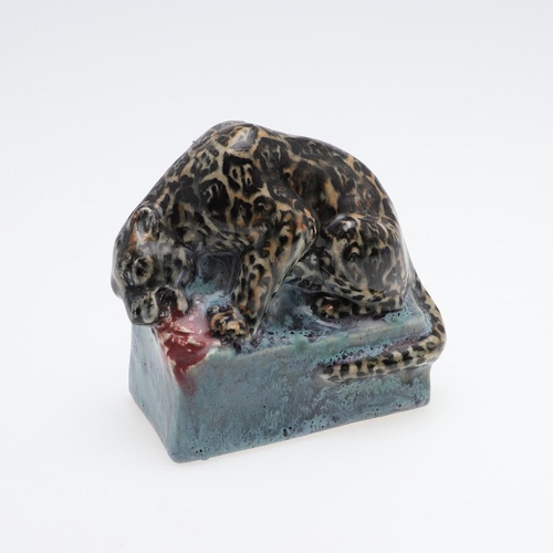 762 - STELLA CROFTS (1898-1964) - POTTERY LEOPARD. A small stoneware figure of a Leopard eating it's prey,... 