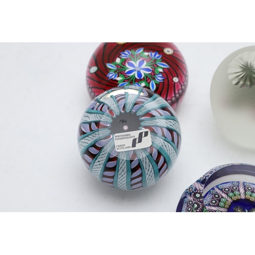 773 - PERTHSHIRE GLASS PAPERWEIGHTS. Four Perthshire paperweights including Magnum Millefiori a faceted ca... 