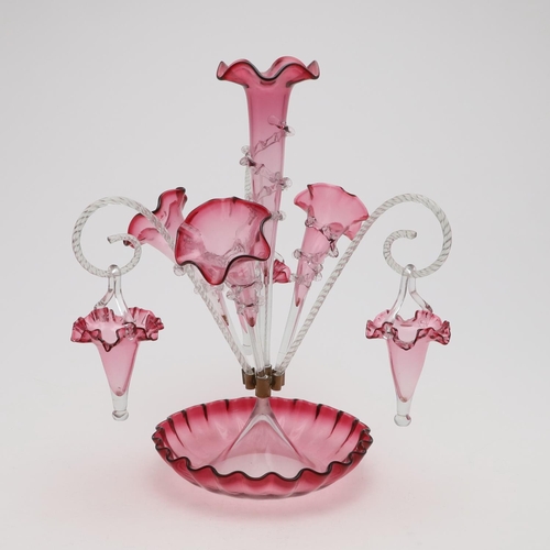 777 - VICTORIAN GLASS CRANBERRY EPERGNE. A large cranberry epergne, with a central trumpet, three addition... 