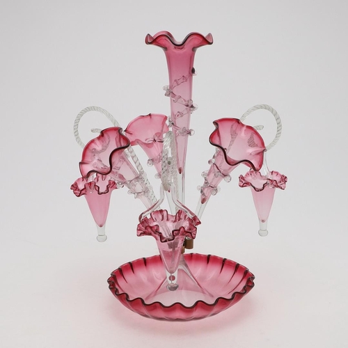 777 - VICTORIAN GLASS CRANBERRY EPERGNE. A large cranberry epergne, with a central trumpet, three addition... 