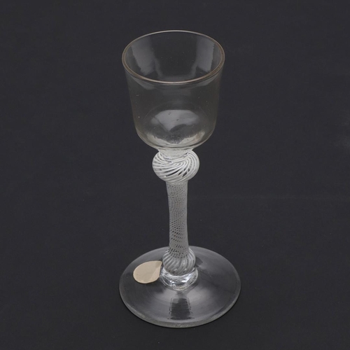 778 - 18THC WINE GLASS - OPAQUE TWIST. The wine glass with ogee shaped bowl, with shoulder and lower knop ... 