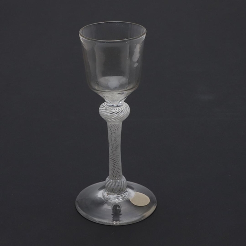 778 - 18THC WINE GLASS - OPAQUE TWIST. The wine glass with ogee shaped bowl, with shoulder and lower knop ... 