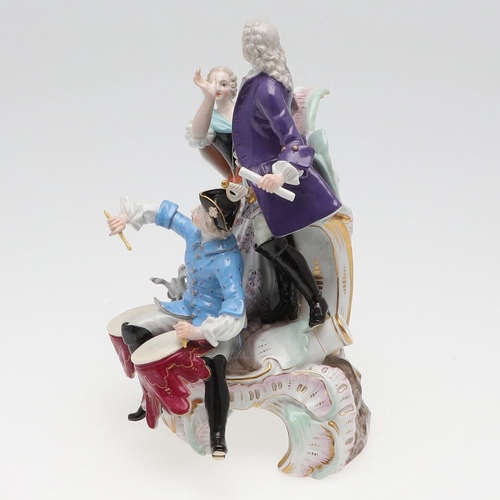 820 - MEISSEN PORCELAIN FIGURE GROUP. 19thc, modelled as a gallant standing on scrolled rockwork, with a m... 