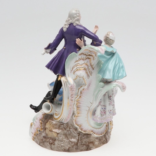 820 - MEISSEN PORCELAIN FIGURE GROUP. 19thc, modelled as a gallant standing on scrolled rockwork, with a m... 