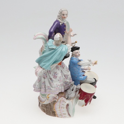 820 - MEISSEN PORCELAIN FIGURE GROUP. 19thc, modelled as a gallant standing on scrolled rockwork, with a m... 