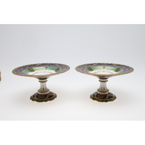 831 - CROWN DERBY DESSERT SERVICE. An unusual dessert service, with gilded decoration on a blue and green ... 