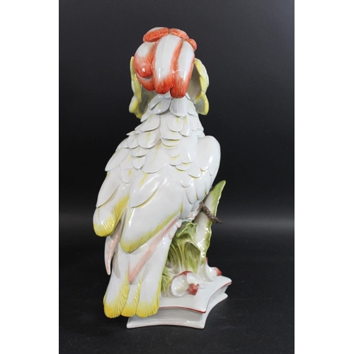 837 - LARGE MEISSEN COCKATOO. 20thc, an unusually large model of a Cockatoo perched amongst foliage, and o... 