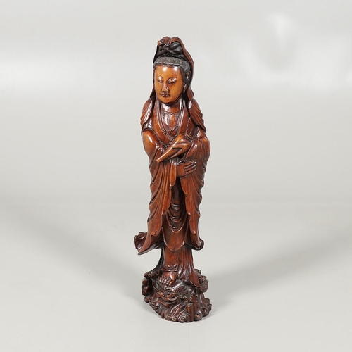 839 - LARGE CHINESE CARVED WOODEN FIGURE - GUANYIN. A late 19thc/early 20thc carved wooden figure of Guany... 