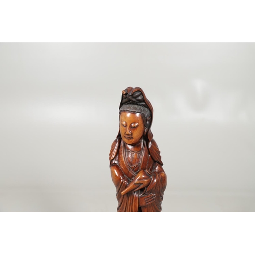 839 - LARGE CHINESE CARVED WOODEN FIGURE - GUANYIN. A late 19thc/early 20thc carved wooden figure of Guany... 