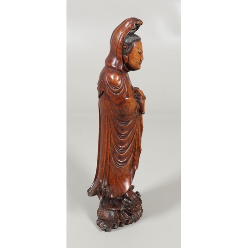 839 - LARGE CHINESE CARVED WOODEN FIGURE - GUANYIN. A late 19thc/early 20thc carved wooden figure of Guany... 