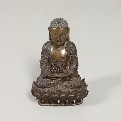 840 - EARLY CHINESE BRONZE BUDDHA. Possibly Ming Dynasty, the figure sat in contemplation on a lotus leaf ... 