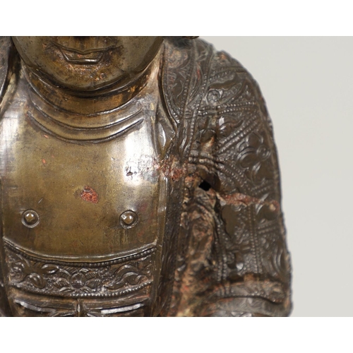 840 - EARLY CHINESE BRONZE BUDDHA. Possibly Ming Dynasty, the figure sat in contemplation on a lotus leaf ... 