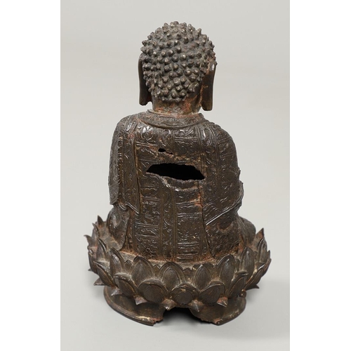 840 - EARLY CHINESE BRONZE BUDDHA. Possibly Ming Dynasty, the figure sat in contemplation on a lotus leaf ... 