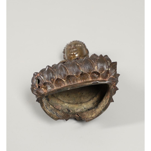 840 - EARLY CHINESE BRONZE BUDDHA. Possibly Ming Dynasty, the figure sat in contemplation on a lotus leaf ... 