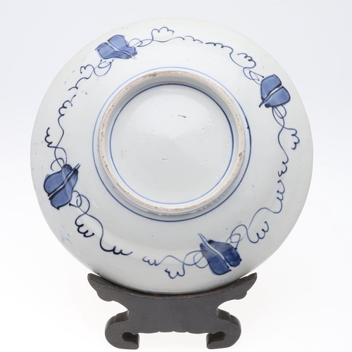 844 - 19THC JAPANESE IMARI DISH. A late 19thc Japanese Imari dish, painted in the centre with a vase of fl... 