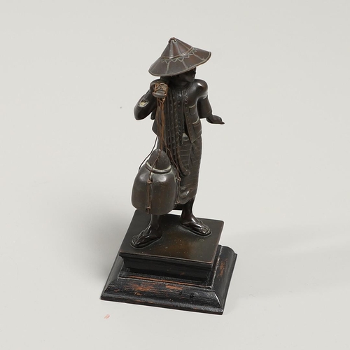 846 - SOUTH EAST ASIAN BRONZE FISHERMAN. A bronze figure of a Fisherman, carrying two storage jars suspend... 