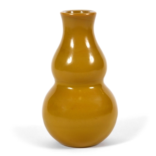 852 - A CHINESE BEIJING GLASS VASE. Probably 19thc, the double gourd shaped vase in an ochre colour. Unmar... 