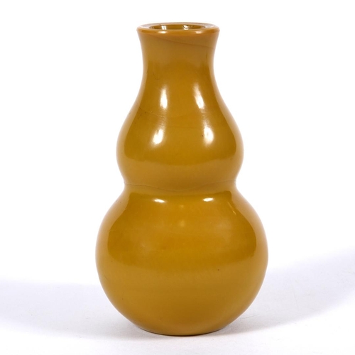 852 - A CHINESE BEIJING GLASS VASE. Probably 19thc, the double gourd shaped vase in an ochre colour. Unmar... 