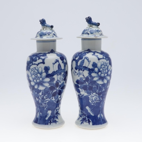 861 - PAIR OF CHINESE BLUE & WHITE VASES & COVERS. A pair of late 19thc Chinese export vases, each painted... 