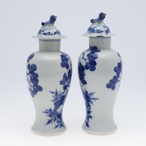 861 - PAIR OF CHINESE BLUE & WHITE VASES & COVERS. A pair of late 19thc Chinese export vases, each painted... 