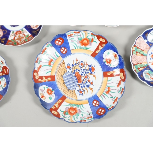 864 - COLLECTION OF JAPANESE IMARI DISHES & PLATES. A large mixed lot including two similar dishes painted... 