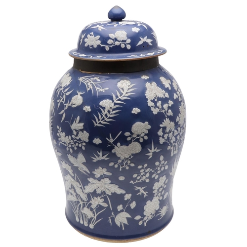 867 - LARGE CHINESE PORCELAIN LIDDED JAR. Probably 19thc, with a white slip in low relief and painted with... 