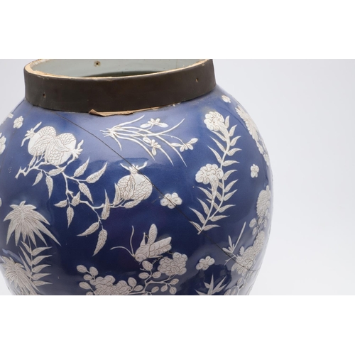 867 - LARGE CHINESE PORCELAIN LIDDED JAR. Probably 19thc, with a white slip in low relief and painted with... 