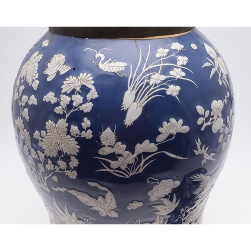 867 - LARGE CHINESE PORCELAIN LIDDED JAR. Probably 19thc, with a white slip in low relief and painted with... 