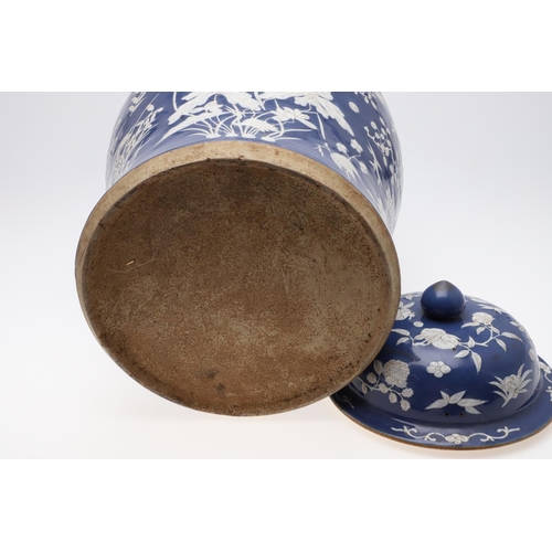 867 - LARGE CHINESE PORCELAIN LIDDED JAR. Probably 19thc, with a white slip in low relief and painted with... 