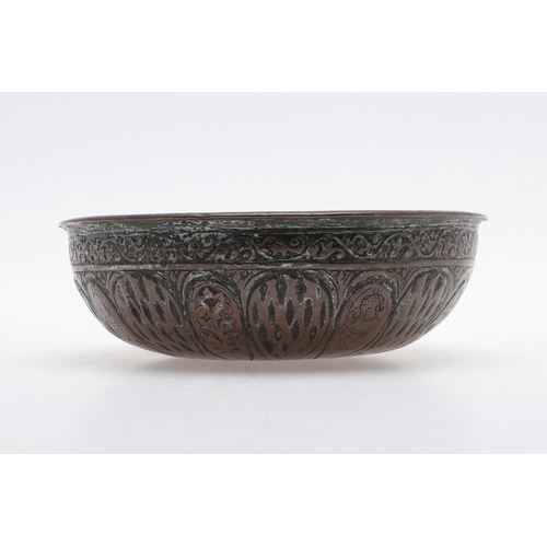 873A - ANTIQUE MIDDLE EASTERN COPPER BOWL - SIGNED. A small shallow bowl, with a repeating pattern includin... 