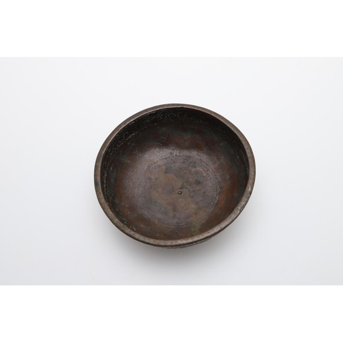 873A - ANTIQUE MIDDLE EASTERN COPPER BOWL - SIGNED. A small shallow bowl, with a repeating pattern includin... 