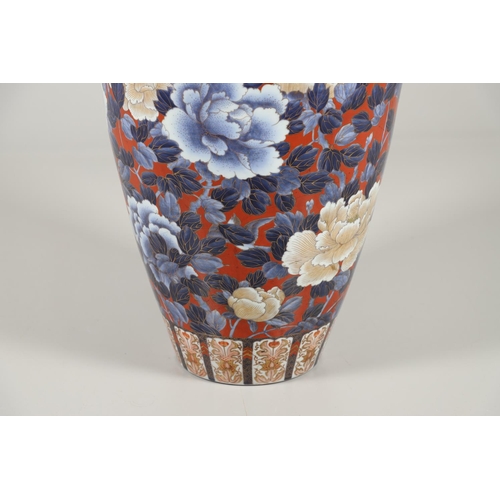 877 - UNUSUALLY LARGE JAPANESE IMARI VASE. 20thc, an unusually large vase of tapering form, painted with f... 