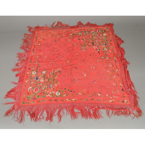 882 - TWO CHINESE SILK EMBROIDERED SHAWLS. Two large Chinese shawls, including a large pink silk shawl, he... 