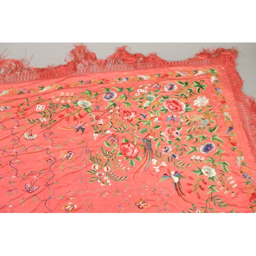 882 - TWO CHINESE SILK EMBROIDERED SHAWLS. Two large Chinese shawls, including a large pink silk shawl, he... 