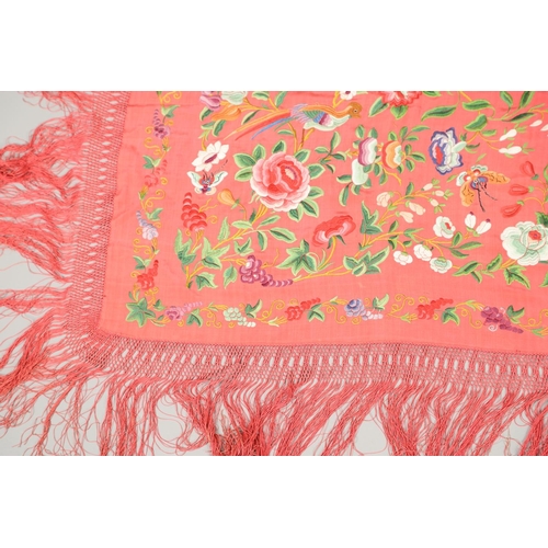 882 - TWO CHINESE SILK EMBROIDERED SHAWLS. Two large Chinese shawls, including a large pink silk shawl, he... 