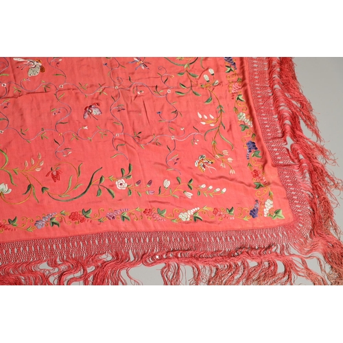 882 - TWO CHINESE SILK EMBROIDERED SHAWLS. Two large Chinese shawls, including a large pink silk shawl, he... 