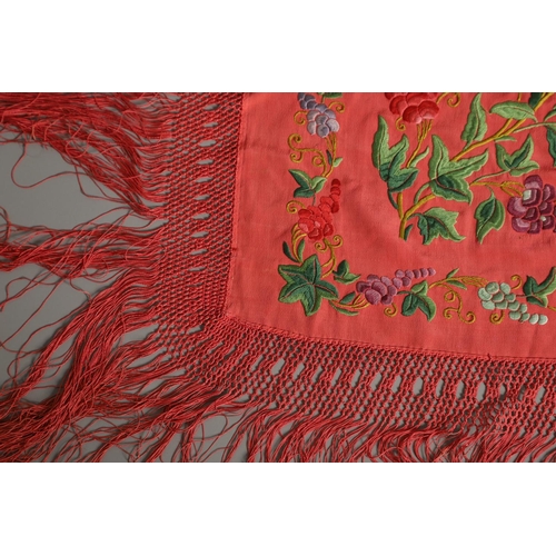 882 - TWO CHINESE SILK EMBROIDERED SHAWLS. Two large Chinese shawls, including a large pink silk shawl, he... 